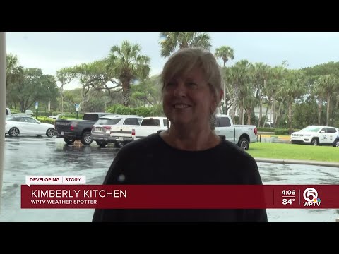 Woman takes cover during tornado warning issued in Fort Pierce