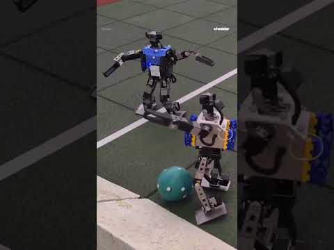 Watch mini AI robots play soccer