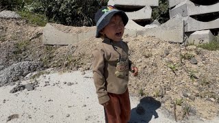 single mother and child help a child on the way to collect scrap