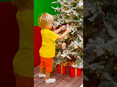 Chris and Mom decorate the Christmas tree