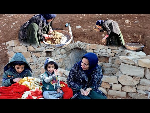 A pregnant nomadic mother builds a stone shelter for her children against the cold and rain.