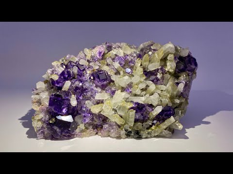 Fine Mineral Specimen: Phantom Fluorite on Quartz with Pyrite from China