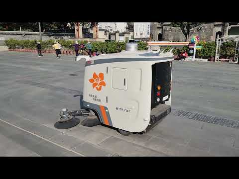 A robot sweeper cleans a street in Guangzhou