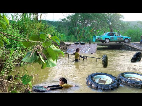 The girl went fishing in a large and small river and caught some wheels drifting ashore.