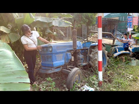 The mechanic girl went to a large junkyard to buy an old farm machine.