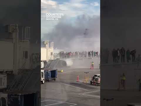 Passengers flee burning plane at Denver airport