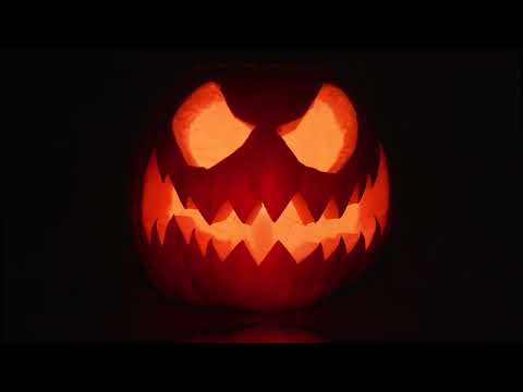 Halloween Pumpkin face with candle light 1 hour background