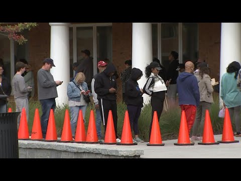 Early voting kicks off: enthusiastic metro Atlanta voters face long lines and machine malfunctions