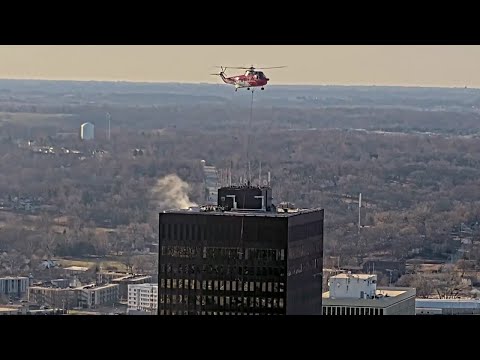 Watch: Helicopter helps crews lift equipment to top of Ruan Center in Des Moines