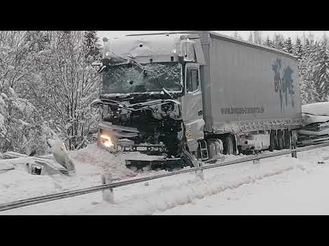 Crashed truck and car into back of semitrailer, E4 Härnösand, Sweden. January 2022