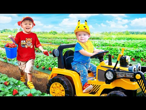 Oliver and Adam feed the Animals on the Farm