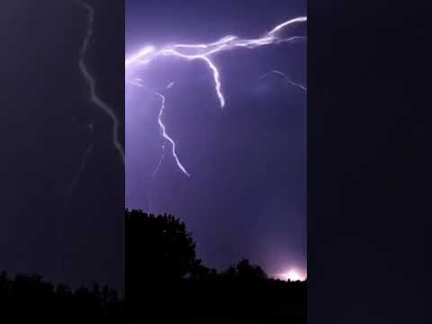 Heavy heavy rain accompanied by thunder and lightning in a breath scene and raises the