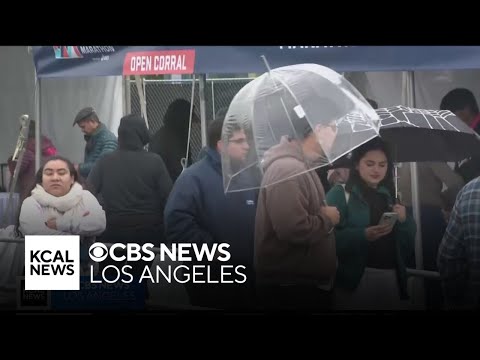 Angelenos bundle up as wet, frigid weather persists across Southern California