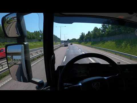 Truck & Trailer driving on Motorway to Västerås, Scania p450