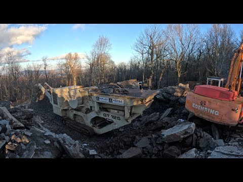 Installing a rock crusher belt and crushing rock