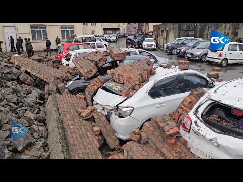 Parked vehicles damaged as wall collapses at JLNM hospital Rainawari amid rains