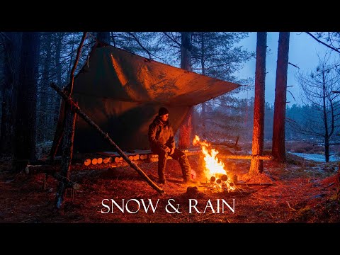 Winter Camping and Building Bushcraft Shelter in the Snow and Rain