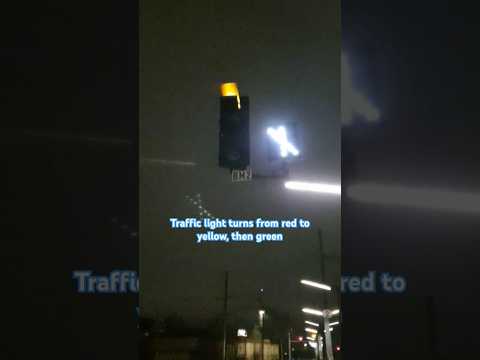 Traffic light turns from red to yellow, then green