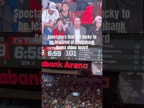 Spectators being featured at the Big TV in Scotiabank Arena during NBA game between Raptors & Hawks