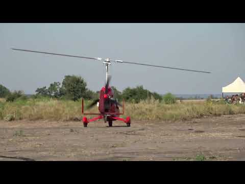 Red gyroplane Rotmistrovka airfield. Cherkasy region. Takeoff of YASLA Small Aviation